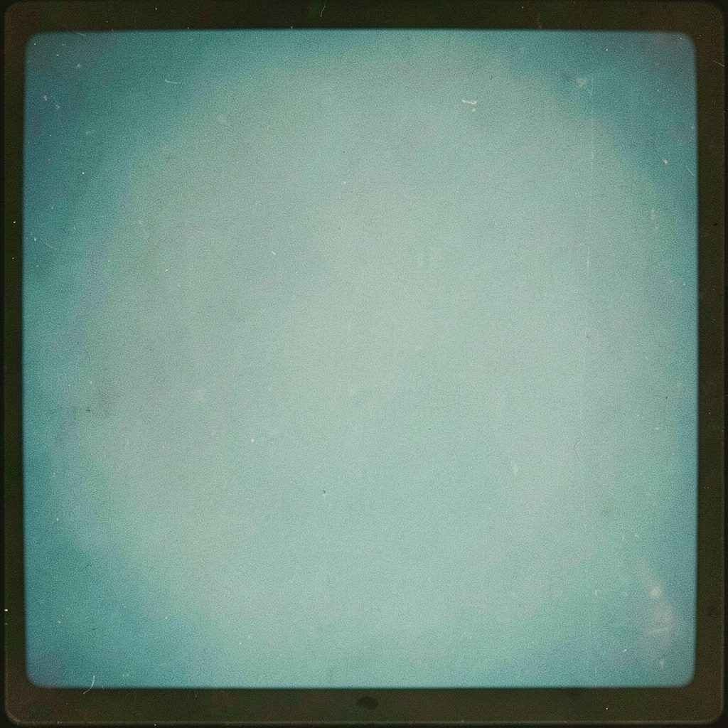 Small square photograph of a graduation cap resting on books, soft grey and brown palette, quiet mood, film grain